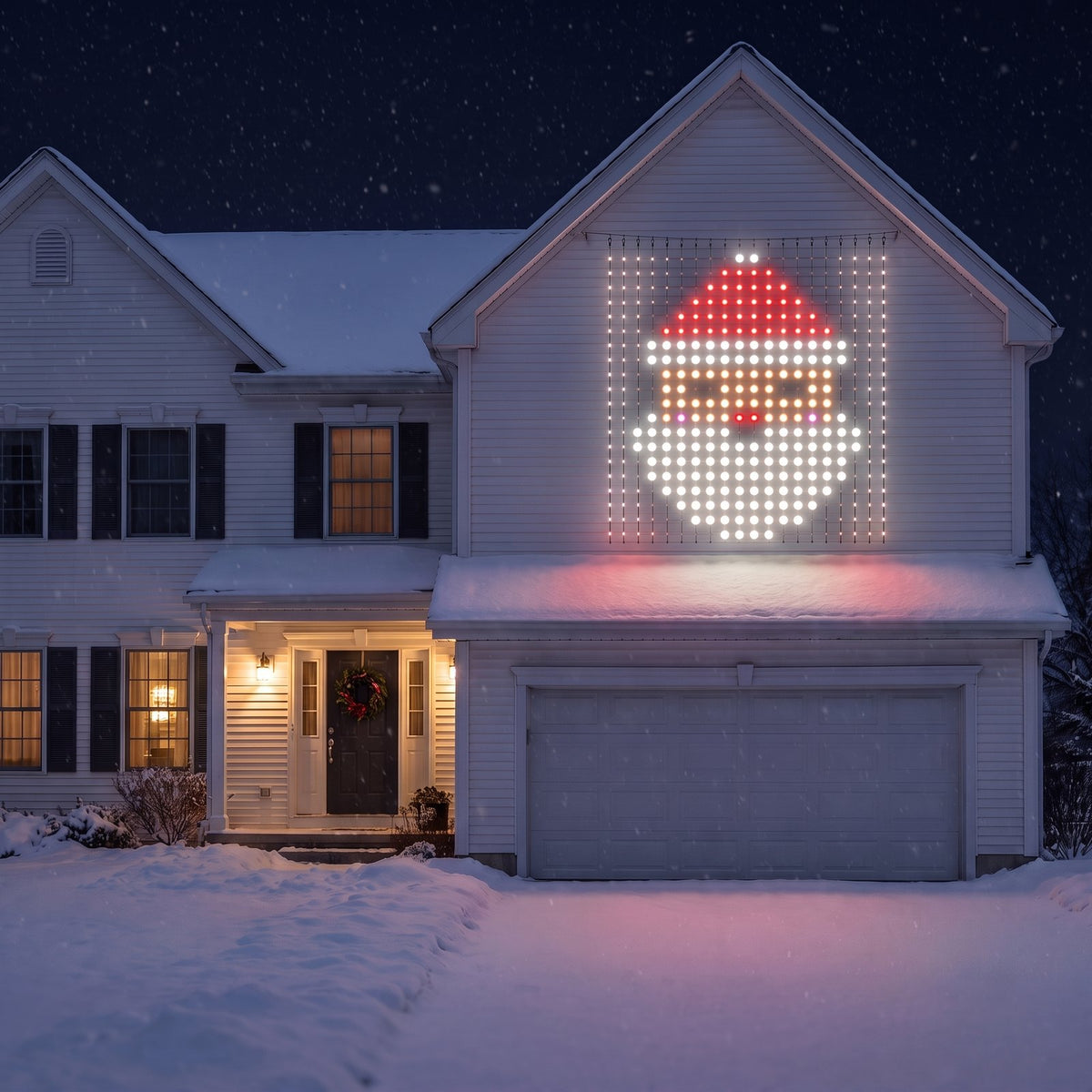 Cheriemood LED curtain showing Santa on the wall above the garage of a snowy American house at night