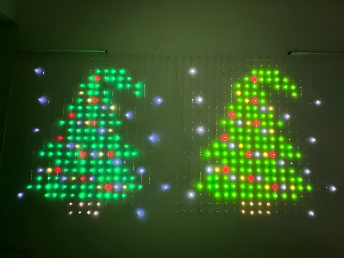 Real photo: Two curtains, two Christmas trees, photographed in a dark room. Every dot is one LED.